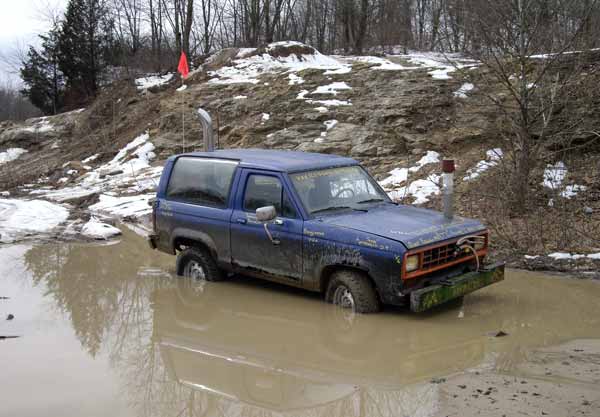 Tristan's Bronco sat in a big puddle